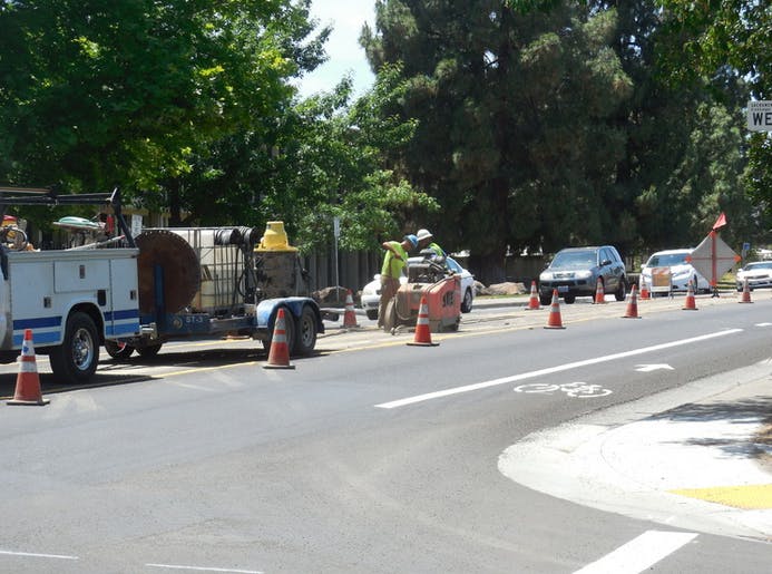 May contain: tarmac, asphalt, truck, vehicle, transportation, road, car, automobile, human, person, machine, and wheel