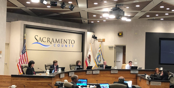 May contain: person, human, indoors, room, classroom, school, crowd, and audience