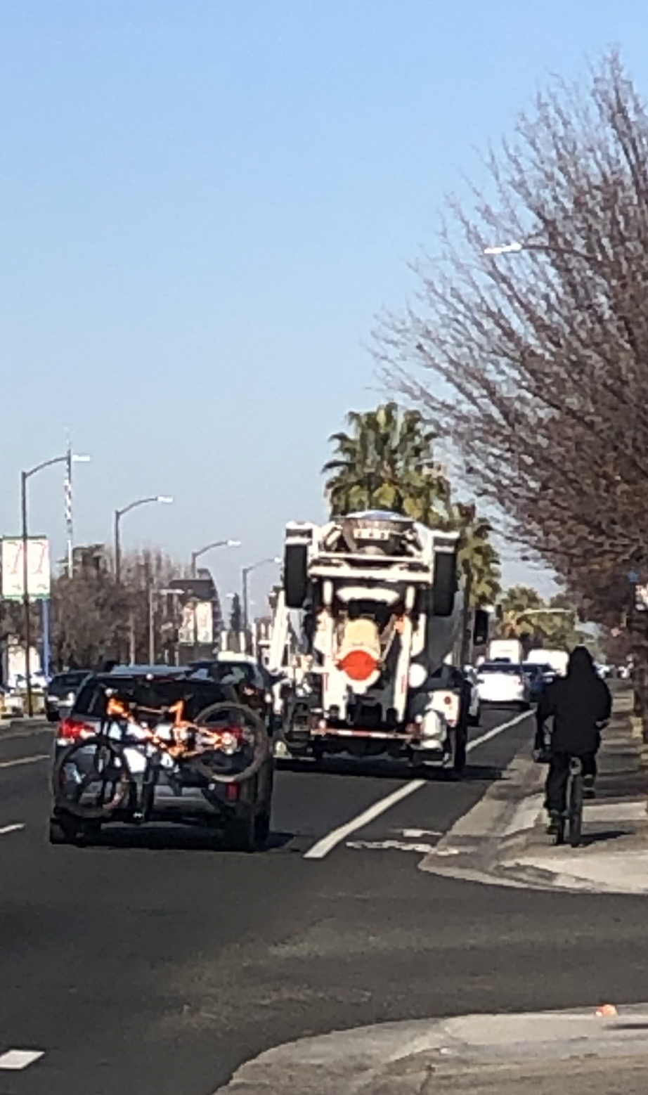 May contain: road, tarmac, person, woman, adult, female, street, city, urban, truck, vehicle, and transportation