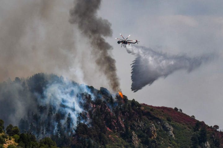 May contain: aircraft, helicopter, transportation, vehicle, and fire