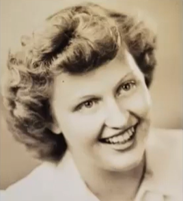 The image features a smiling woman with wavy hair, captured in a vintage-style photograph.