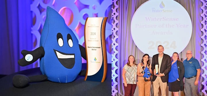 Award ceremony with a mascot, a trophy, and four smiling individuals.