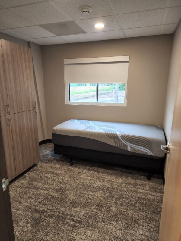 May contain: corner, bed, bedroom, dorm room, furniture, indoors, room, interior design, and floor