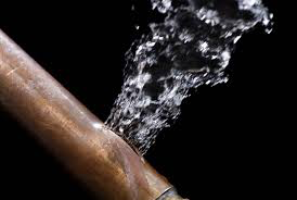 Water spurting from ruptured copper pipe