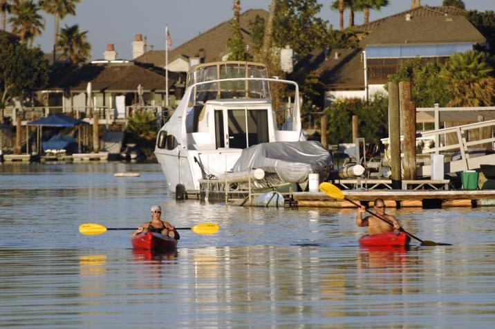 May contain: person, human, boat, vehicle, transportation, and rowboat