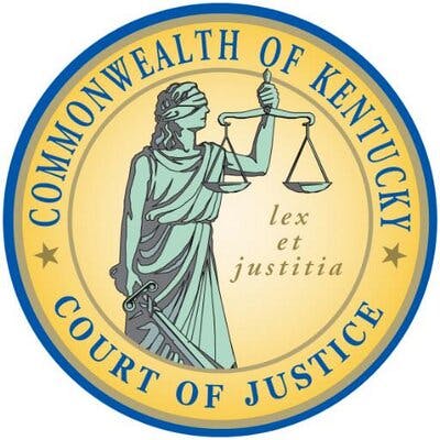 This is a logo, likely the seal of the Kentucky Court of Justice, featuring Lady Justice with scales and a sword.