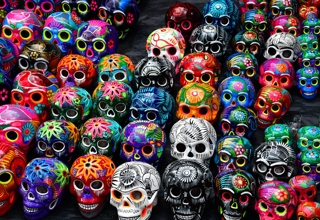 Colorful decorated skulls, likely for Día de los Muertos (Day of the Dead) celebration.
