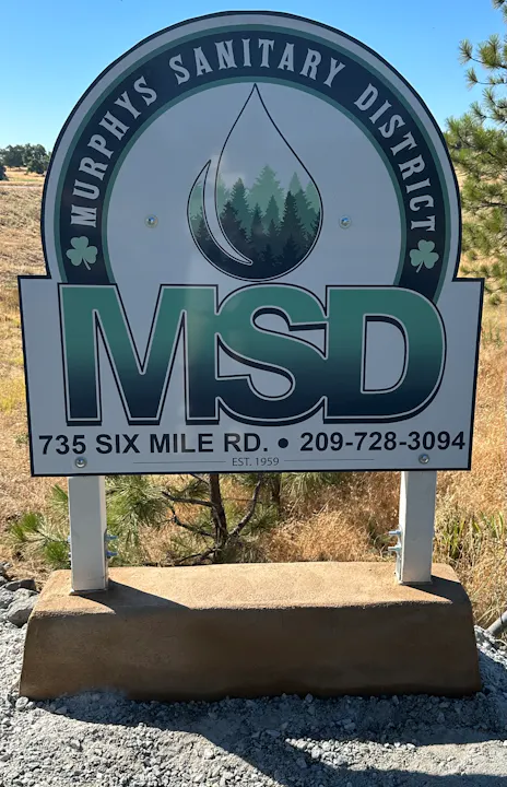 The image shows a sign for Murphys Sanitary District (MSD) with contact info and establishment date (1959).