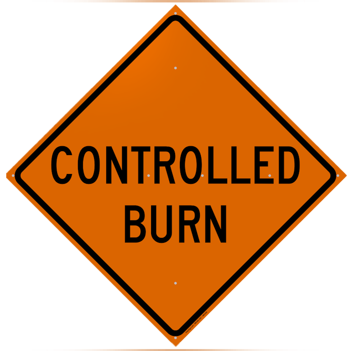 An orange traffic sign with "CONTROLLED BURN" written on it.