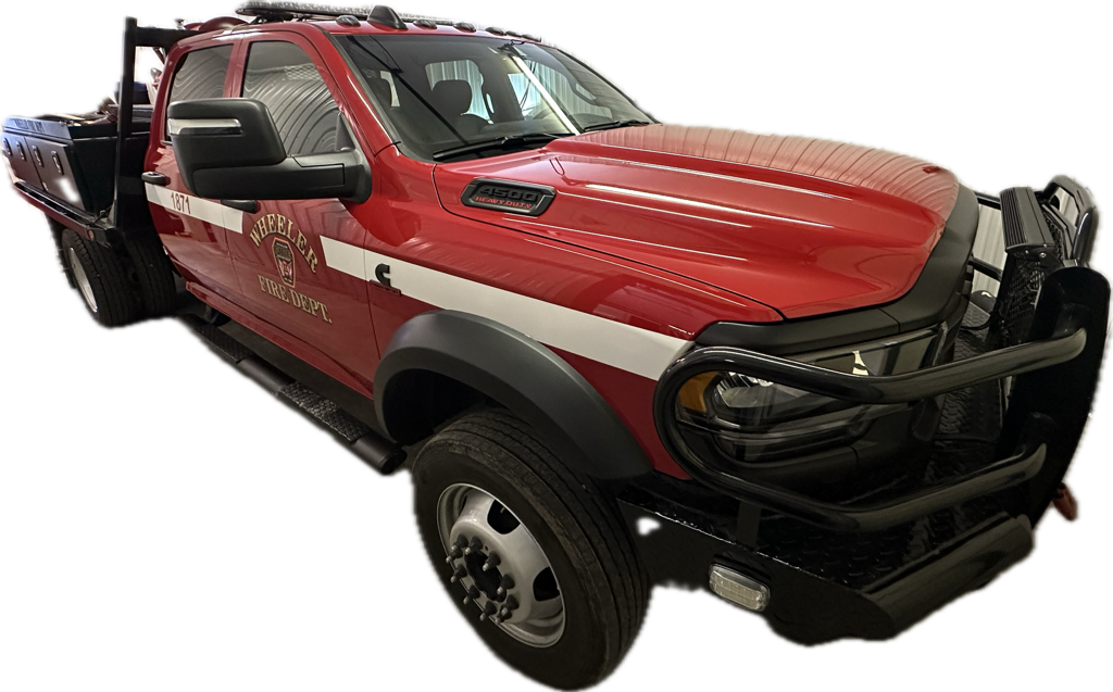 Red and white fire department pickup truck with a brush guard.