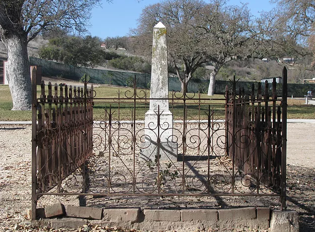 May contain: cast iron fence, grave marker