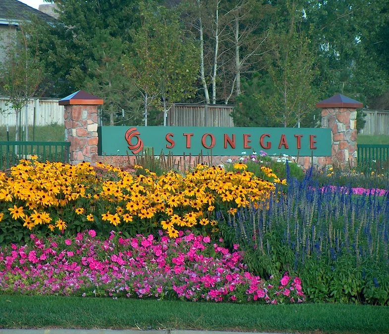 Photo of Stonegate sign and flowers