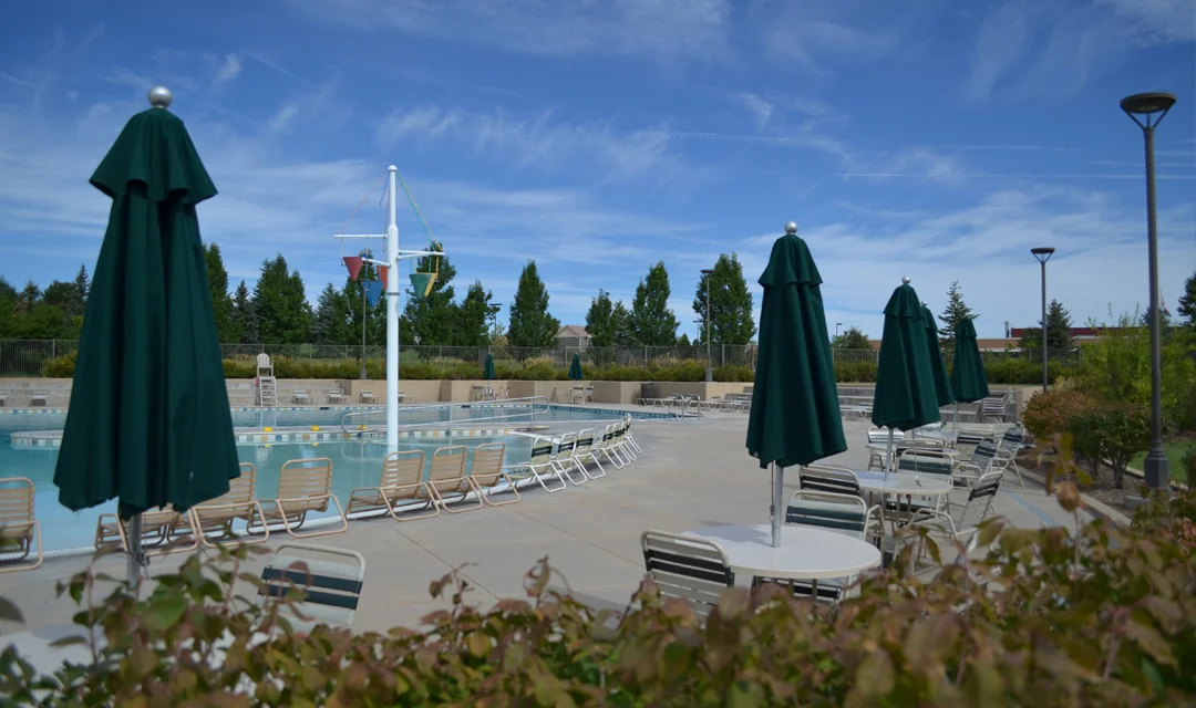 Photo of a pool patio and tables and chairs