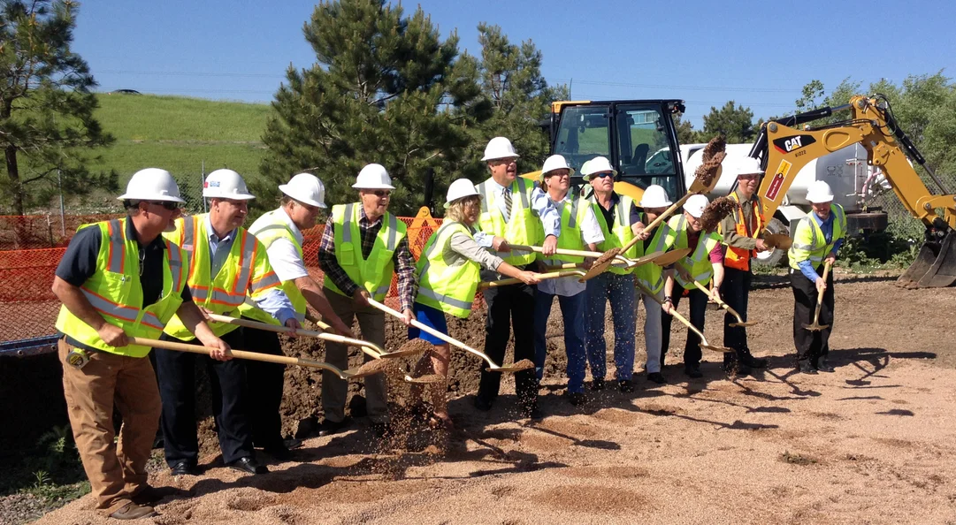 Photo of construction workers with shovels