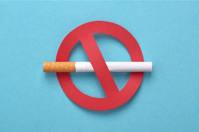 A cigarette crossed by a red prohibition symbol, signifying no smoking.