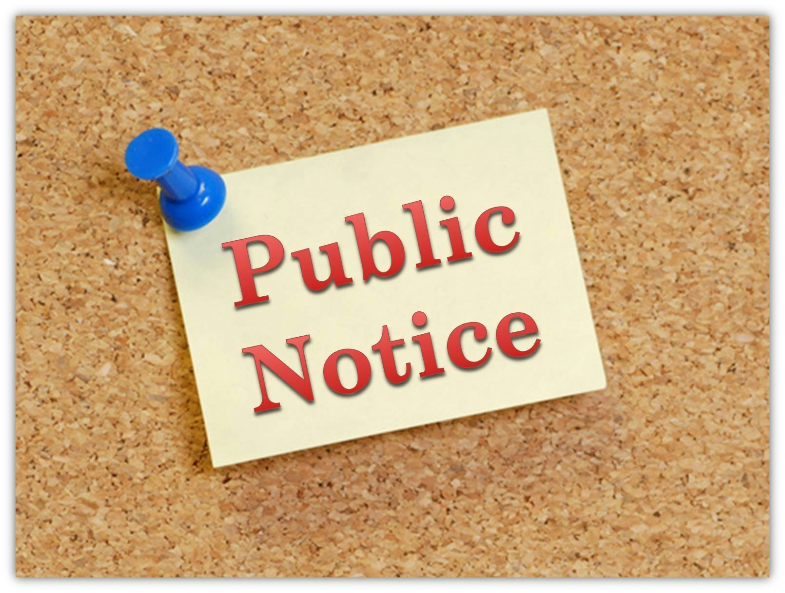 Push Pin on cork board holding a yellow sticky reading Public Notice