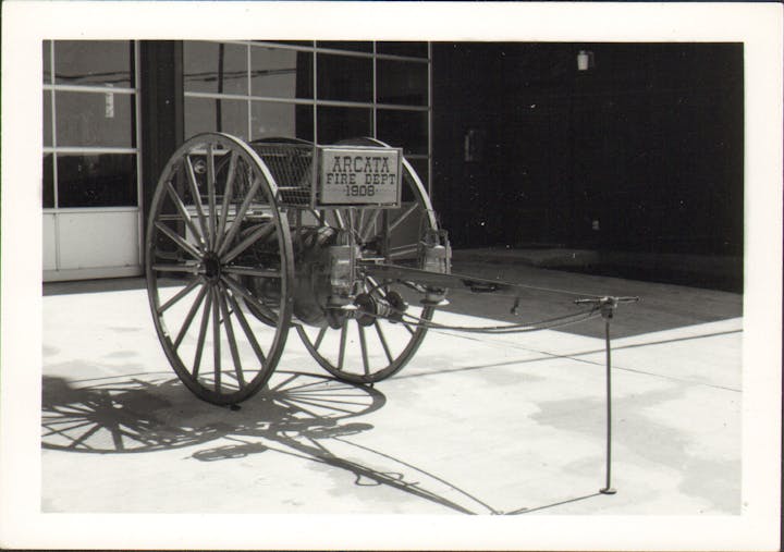 Photo of vintage chemical cart in front of Mad River Station