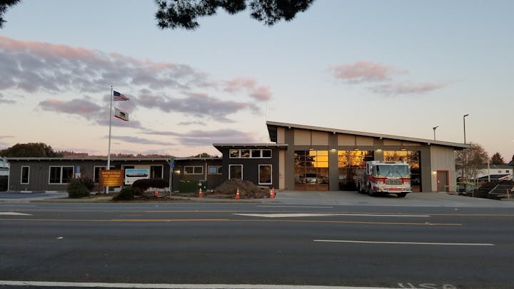 Photo of McKinleyville Station with an engine in the driveway.