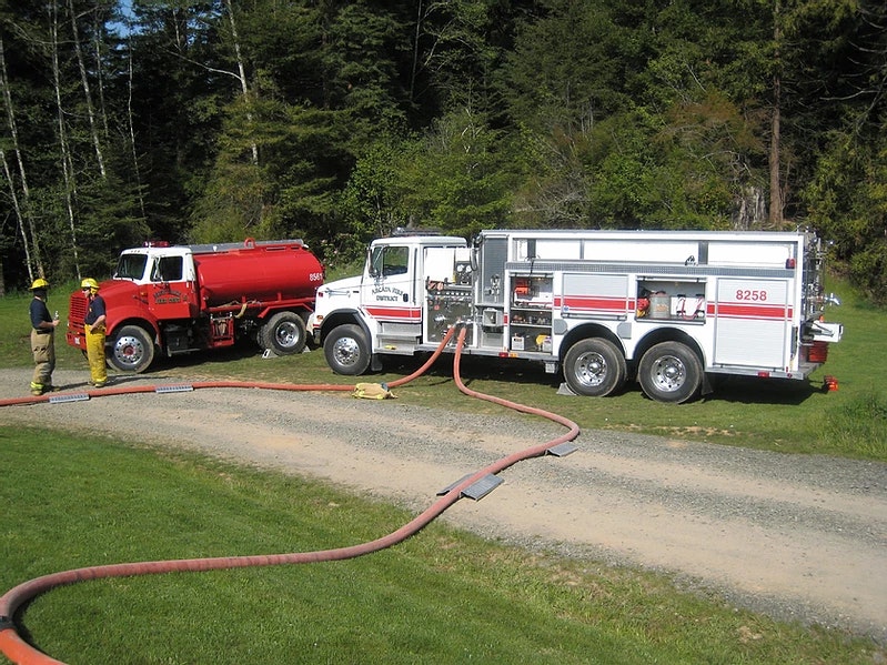 Two water tenders in operation at a fire.