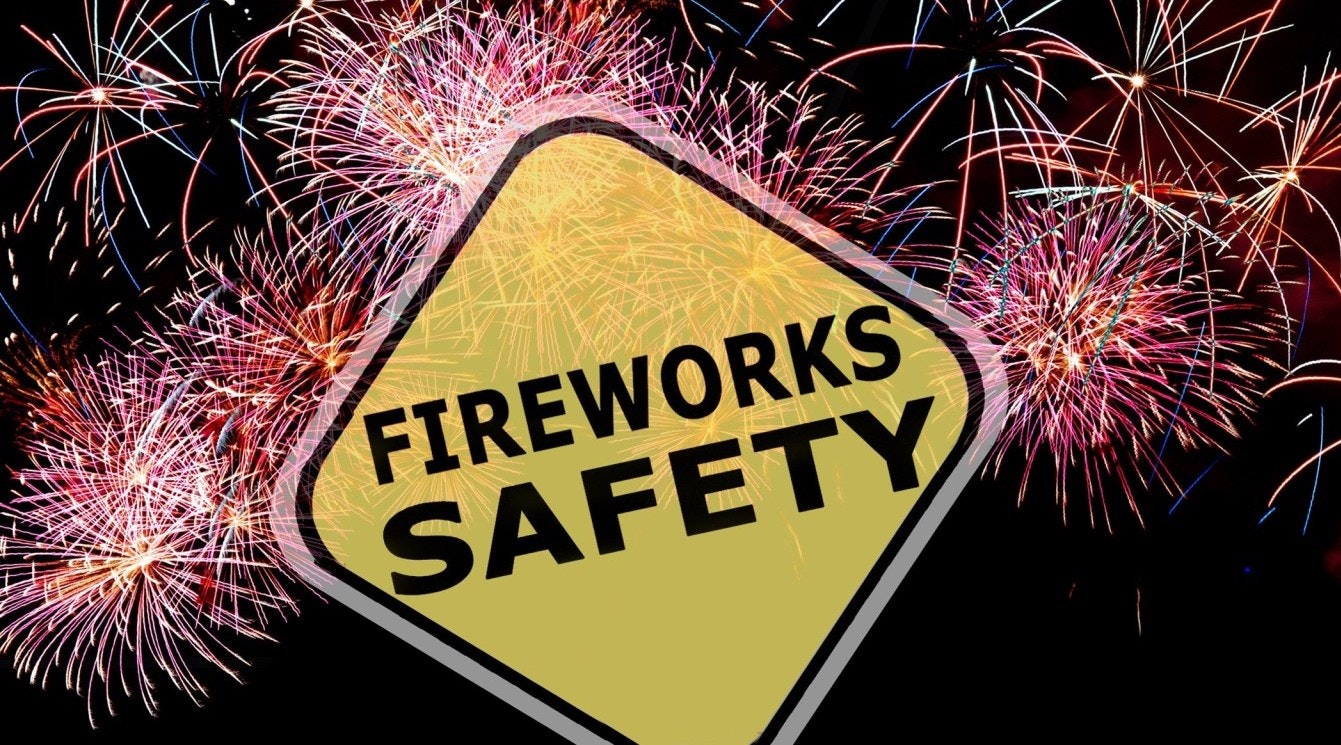 Yellow Safety Sign and fireworks, and night