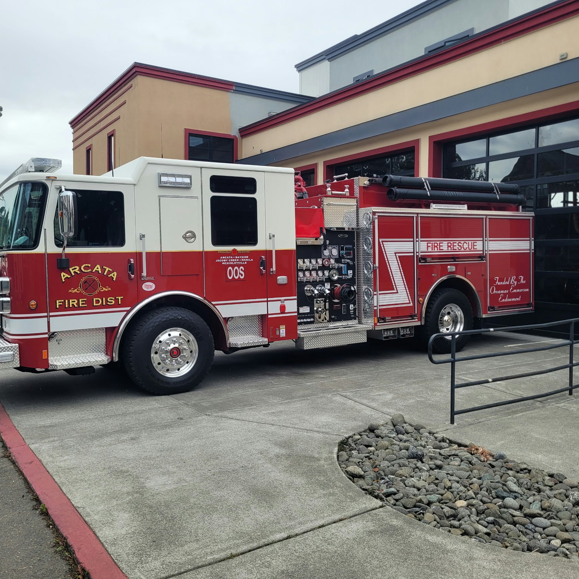 The image shows a red fire truck parked outside a fire station, labeled "Arcata Fire Dist" and "Fire Rescue."