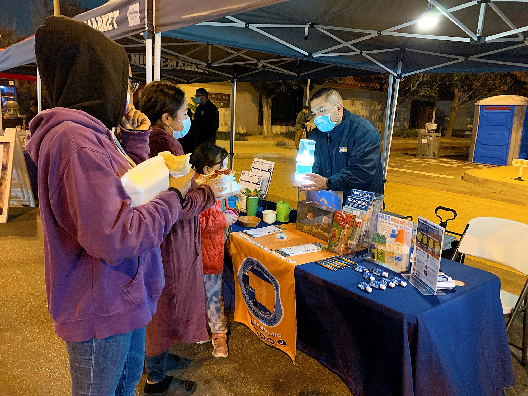 A group of people at an informational booth