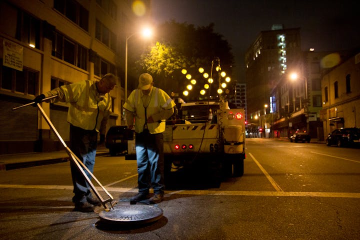 May contain: person, human, car, transportation, vehicle, automobile, tarmac, and asphalt