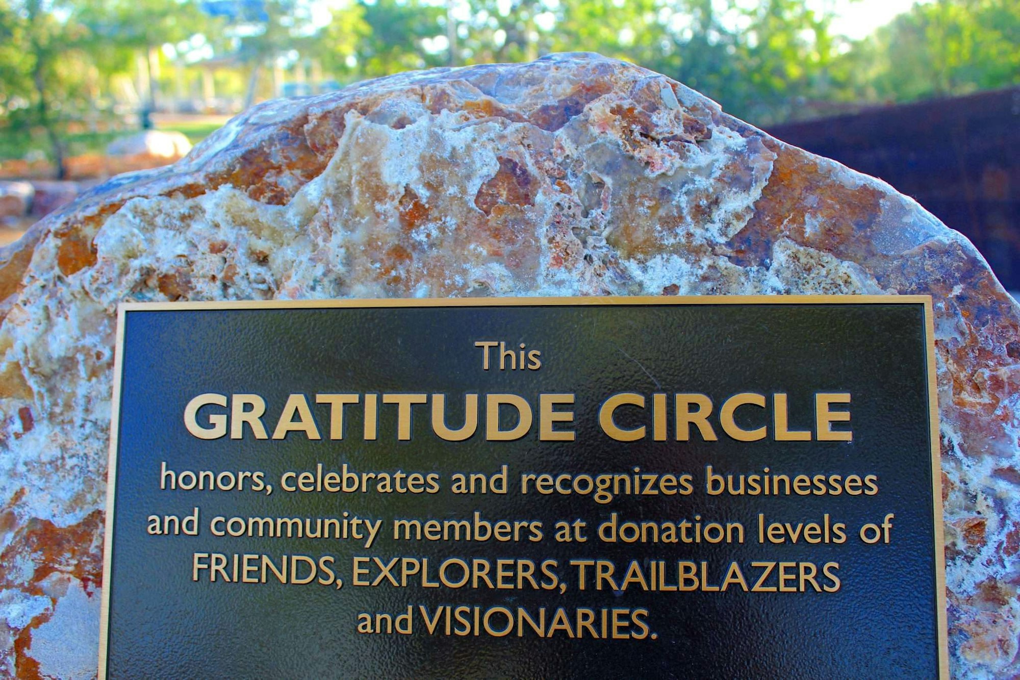 Plaque honoring Gratitude Circle, recognizing businesses and community members at various donation levels.