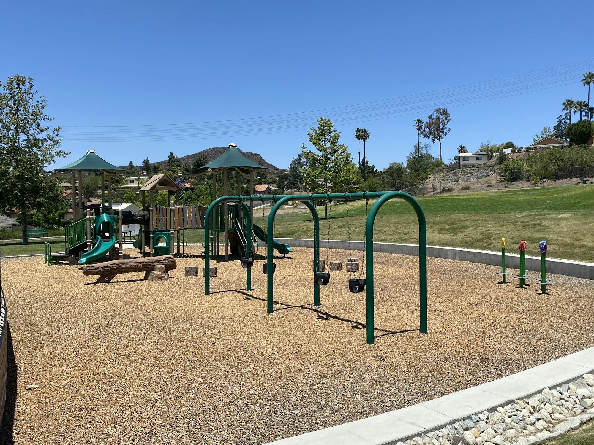 May contain: outdoor play area, outdoors, play area, grass, plant, bench, furniture, nature, and park