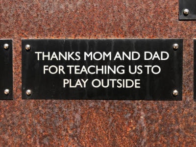 Plaque with the message: "Thanks Mom and Dad for teaching us to play outside."
