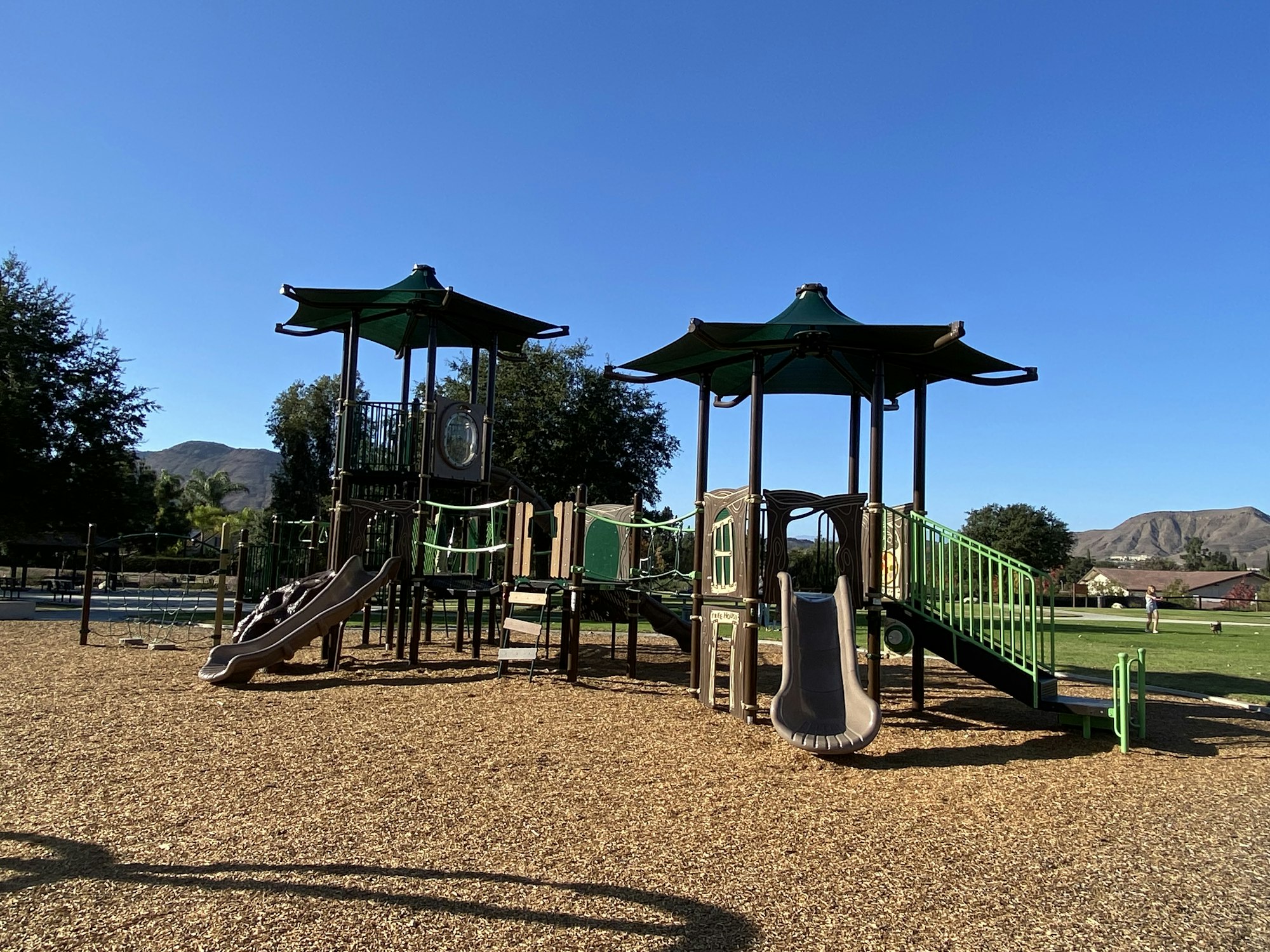 May contain: outdoor play area, outdoors, play area, and person