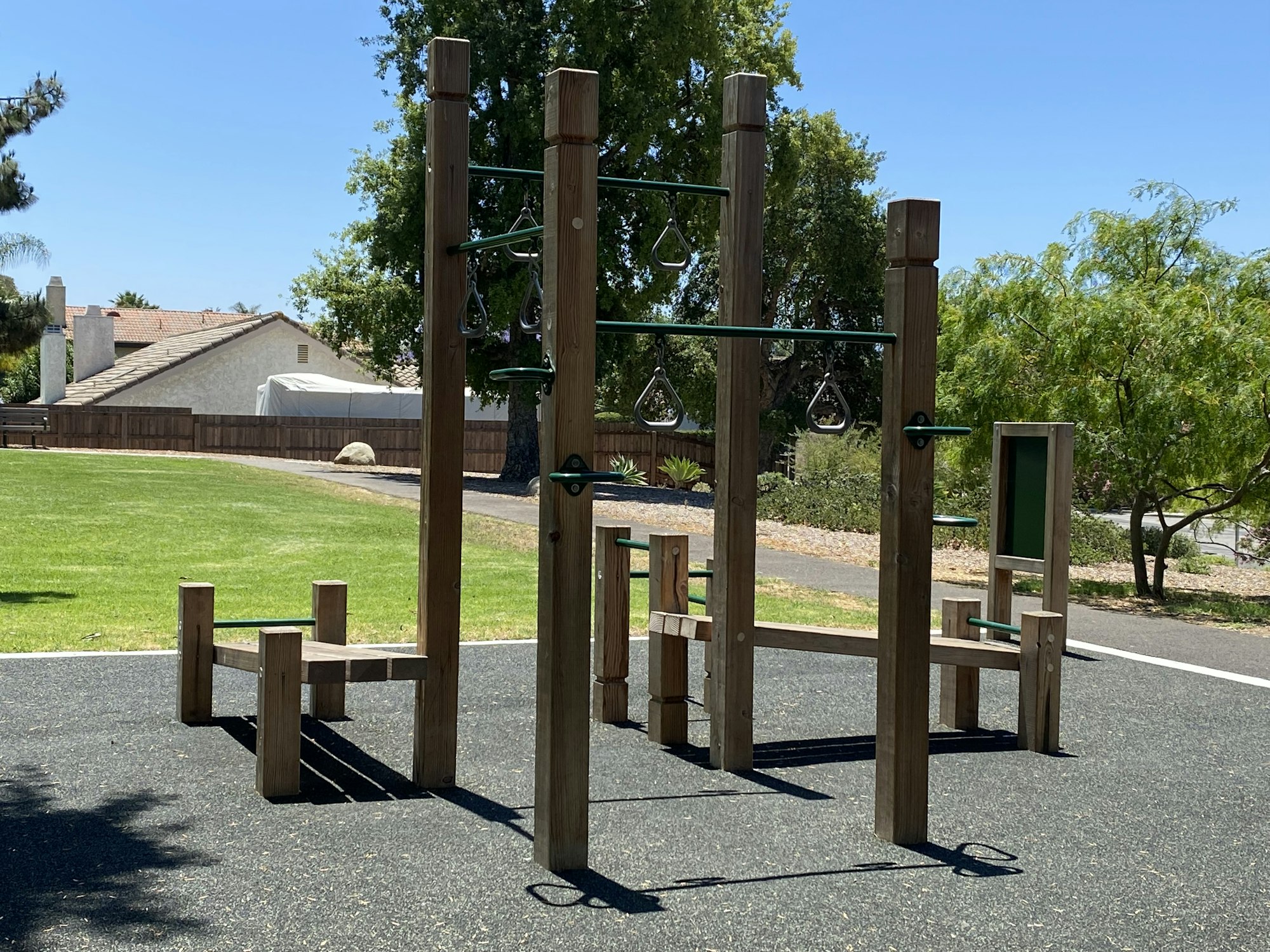 May contain: grass, nature, outdoors, park, plant, outdoor play area, play area, bench, and furniture