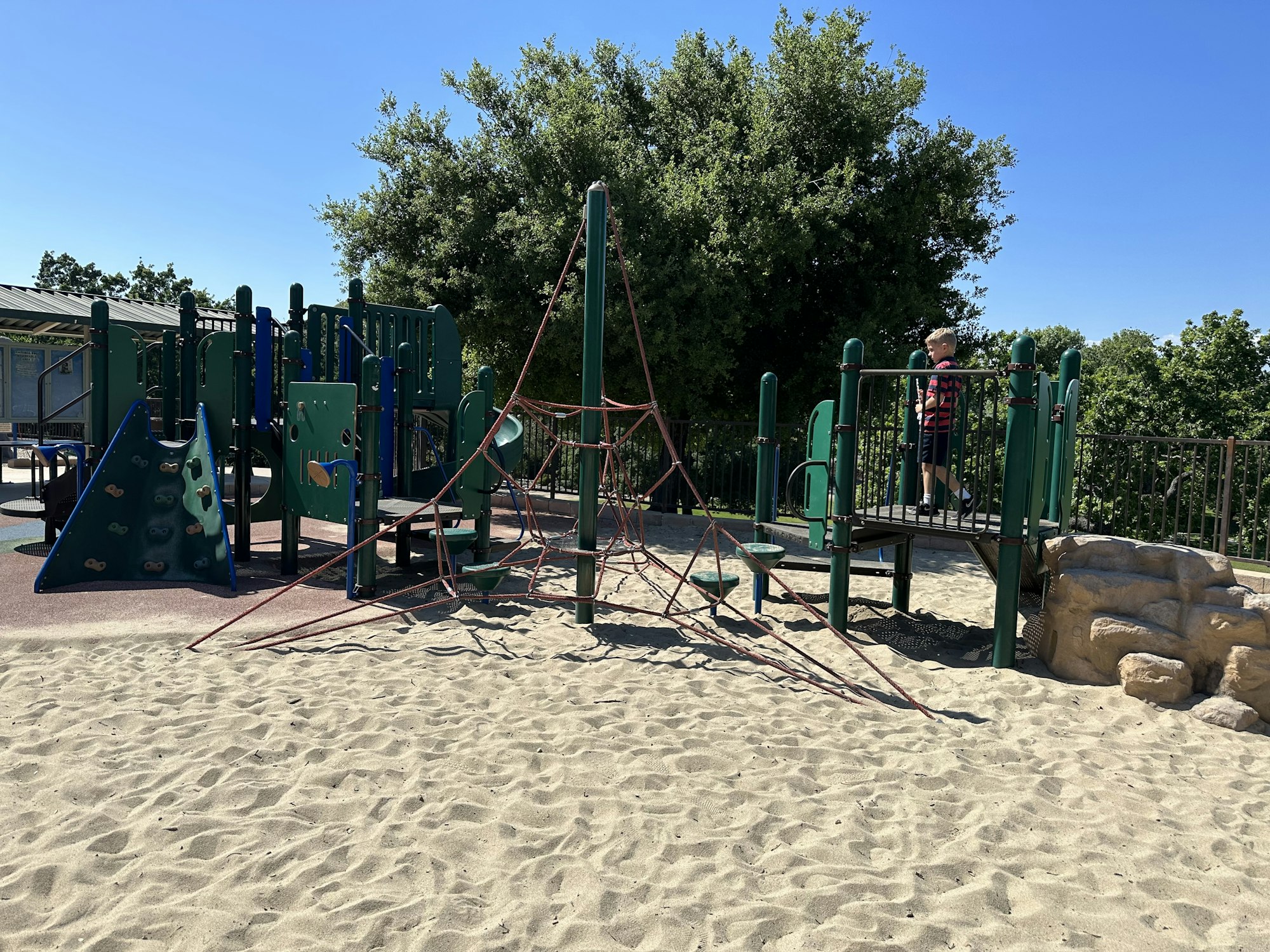 May contain: outdoor play area, outdoors, play area, person, clothing, footwear, and shoe