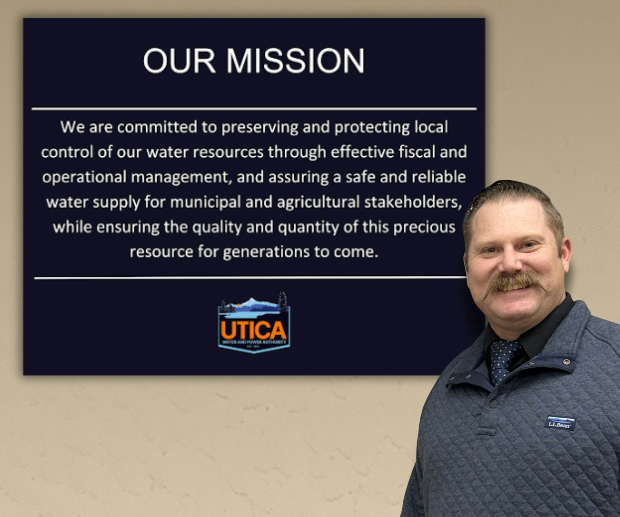 The image features a mission statement about preserving water resources and a man standing next to it, representing Utica Water and Power Authority.