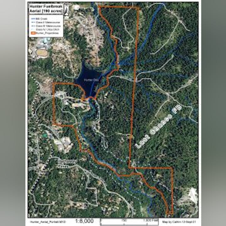Map showing Hunter Foothills, trails, a lake, roads, and surrounding areas with marked boundaries and paths.