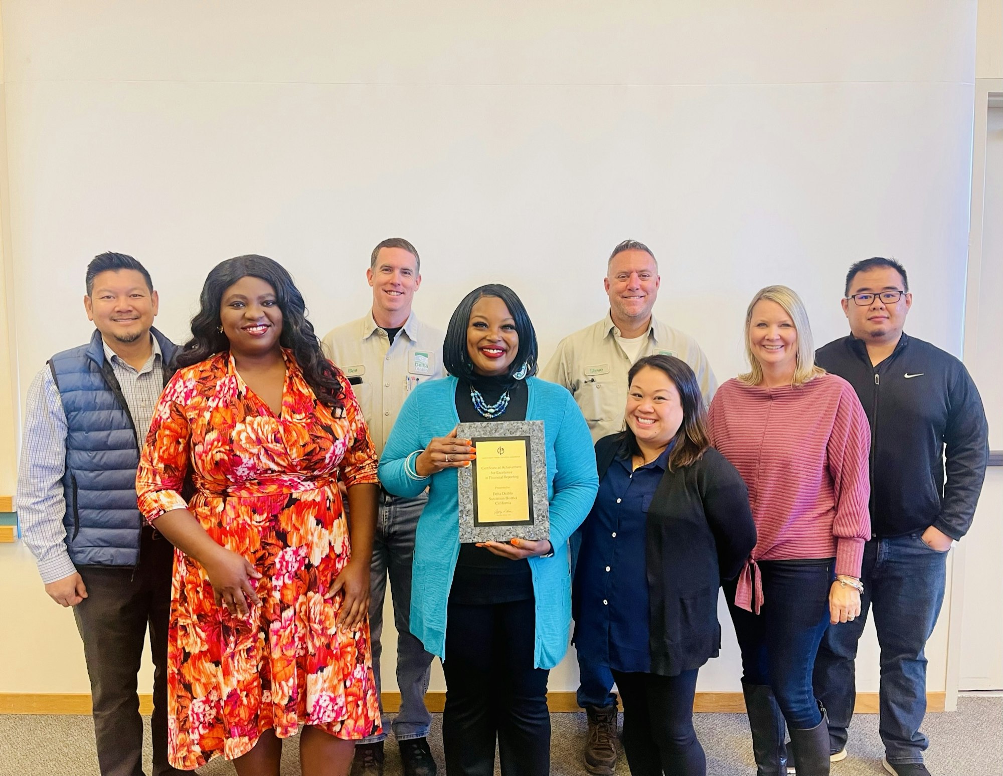 Finance Division standing with award