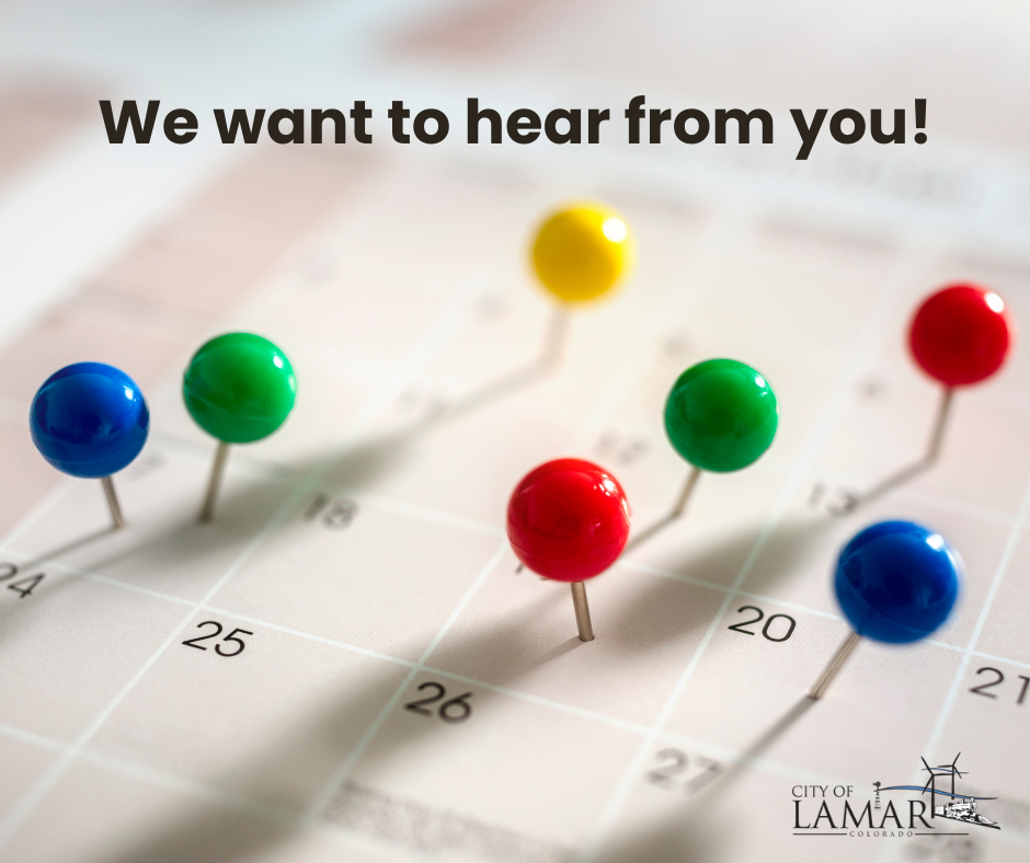 A calendar with colorful pushpins and the message "We want to hear from you!" from the City of Lamar, Colorado.