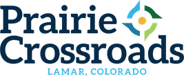 Logo for "Prairie Crossroads" with "Lamar, Colorado" below.