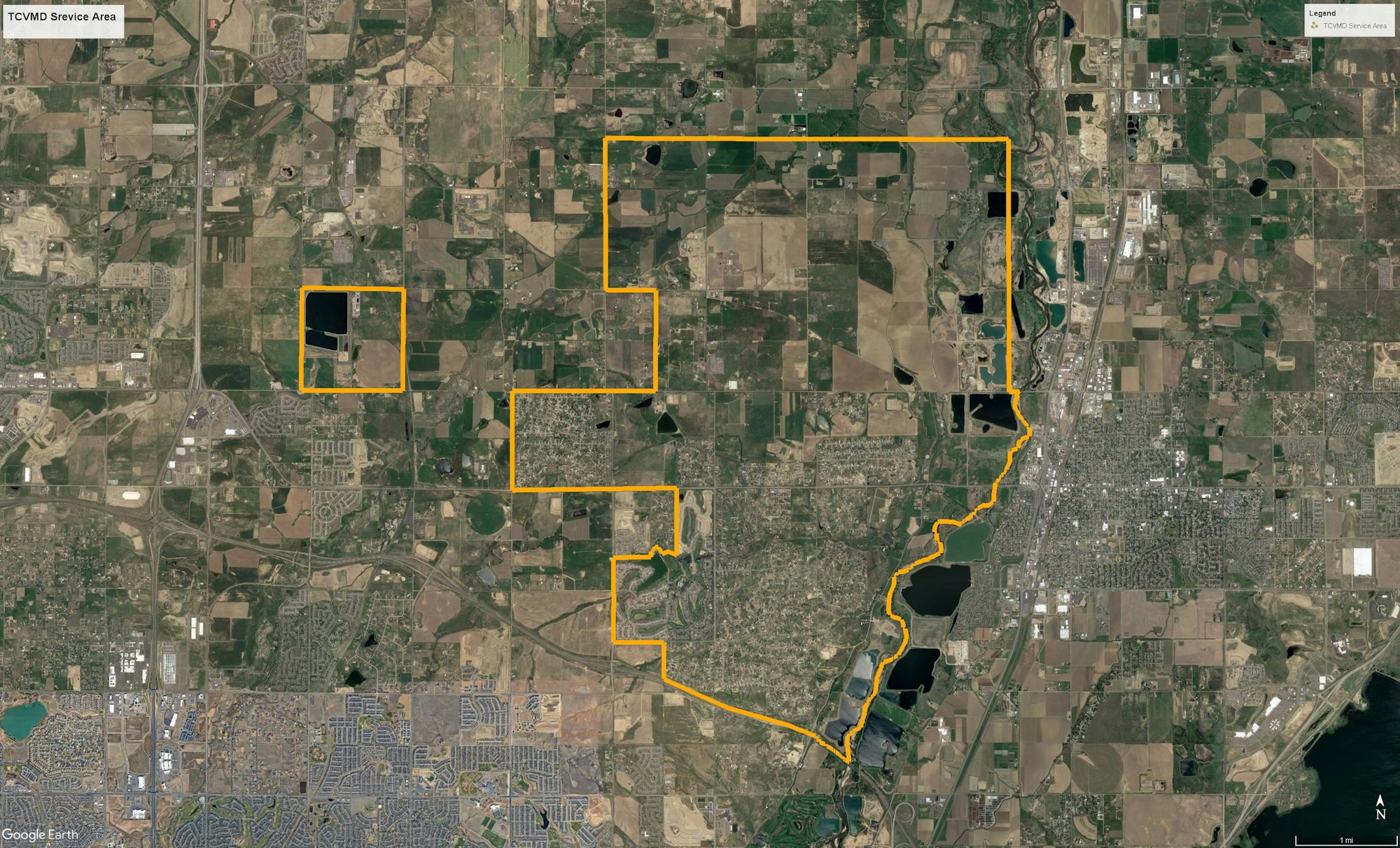 An aerial map showing Todd Creek Village Metro District Service Area, with a key and boundaries marked in yellow.