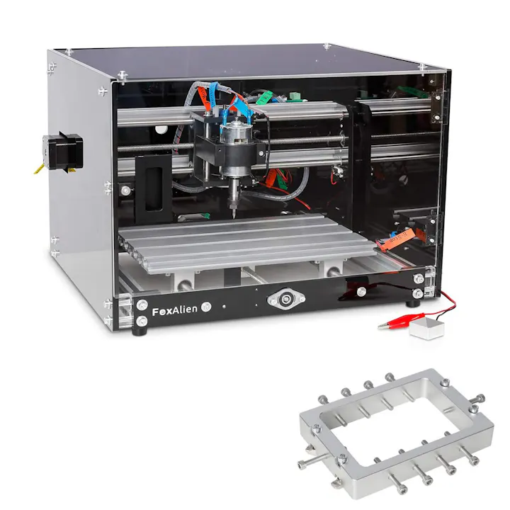 A FoxAlien CNC machine with a cutting tool, alongside a metal part or fixture, likely used in machining or prototyping.