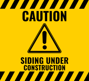 Yellow Caution symbol asking community to be cautious when entering the building due to siding construction.