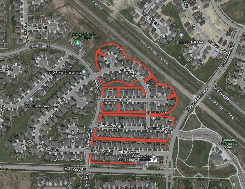 Satellite view of a residential area with highlighted roads outlining a heart shape.