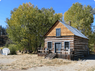 May contain: architecture, building, cabin, house, housing, and log cabin
