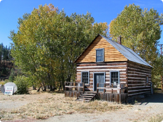 May contain: architecture, building, cabin, house, housing, and log cabin