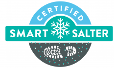 A logo with the text "Certified Smart Salter", featuring a snowflake and a graphic of shoeprints over a spread of salt.