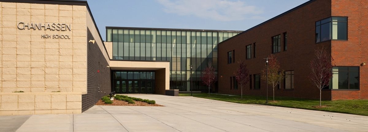 Exterior view of Chanhassen High School with clear skies.