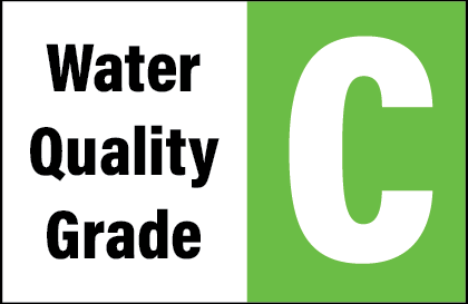 A sign with "Water Quality Grade" on the left and the letter "C" on a green background on the right.