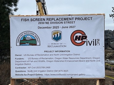 Sign for the Fish Screen Replacement Project at 2650 NE Division St, set for December 2025 to June 2027. Project details included.