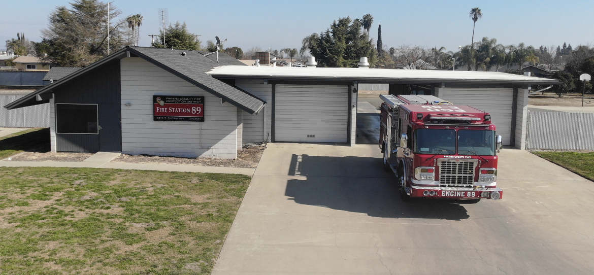 Fresno County Fire Station 89 with grass, plants, Fire truck