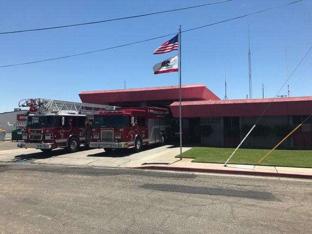 fire trucks in front of fire station
